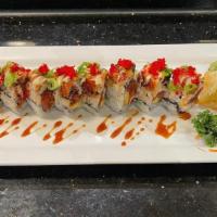 Hawaii Roll · Spicy tuna, avocado and tempura flake topped with eel. Raw/undercooked.