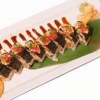 Black Tiger Roll · Shrimp tempura, snow crab meat, avocado, cucumber, flake topped with eel and chef special sa...