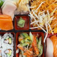 Sushi & Sashimi Bento Box · 6 pieces of sashimi, 3 pieces nigiri, 4 pieces California roll. Raw/undercooked. Served with...