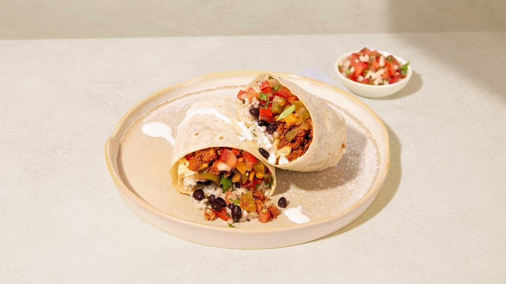 Fajita Burrito · Burrito with your choice of protein, fajitas, white rice, black beans, pico de gallo, and crema.