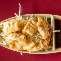 Gyoza (6) · Japanese style pork and vegetable dumplings, hand wrapped in our kitchen. Pan-fried and then...