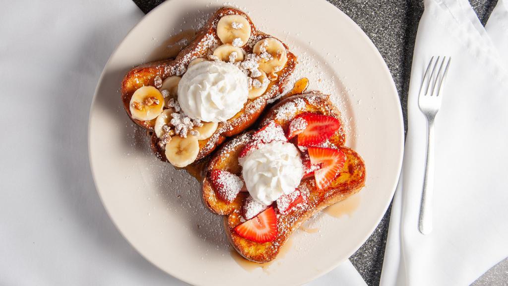Banana Nut French Toast · 2 french toast, topped with bananas pecans, whipped cream, and powdered sugar.