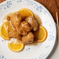 Orange Chicken · Marinated chicken slices pan to perfection with dried orange peels and fluked with garlic an...