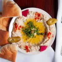 Baba Ganoush · Baked eggplant, mashed garlic, tahini, and spices topped with olive oil.