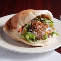 Falafel Sandwich · Patties of spiced chickpeas deep-fried, broiled with salad, pickles, lettuce, and tahini sau...