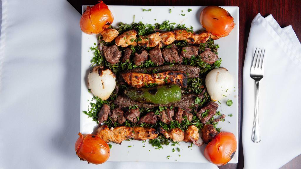 Mix Grill (Serves 2 Person)  · Lamb kabab, shish tawook, shish kabab, and grill chicken tender served with rice and salad.