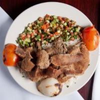 Shawarma Gyro Plate · Slices of lamb and beef served with rice and salad.