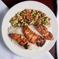 Grilled Chicken Tender · Strips of marinated chicken served with rice and salad.