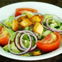 House Salad  · Crisp romaine and iceberg lettuce, mixed greens, cucumbers, tomatoes, onions and croutons wi...