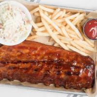 Half Rack · Our signature ribs served with garlic bread and two sides.