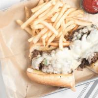 Philly Cheese Steak · Shaved rib-eye steak with grilled onions, sautéed mushrooms, and melted white American chee...