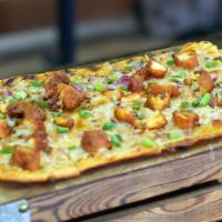 Buffalo Chicken Flatbread · Toasted flatbread topped with medium wing sauce, melted mozzarella cheese, and chopped buffa...