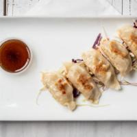 Dumpling (Gyoza) (5) · Chicken, shredded cabbage and spring onions inside a whole wheat flour wrapper.