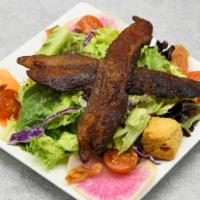 Del'S Salad · Mixed greens, tomatoes, shaved carrots, croutons & crisp bacon.