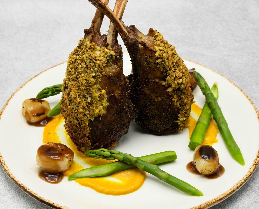 Colorado Lamb Rack · Pistachio and herb crust, toffee carrot puree, sweet and sour pearl onions, asparagus tips, jus.