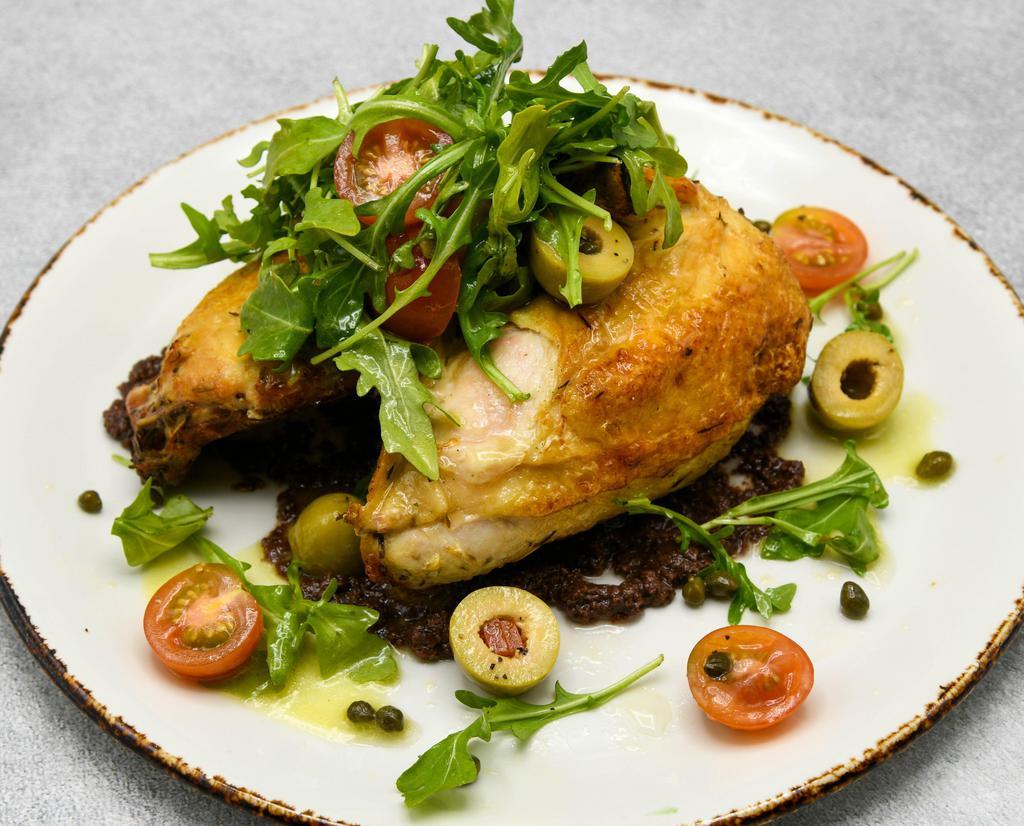 Roasted Chicken · Arugula, heirloom tomato vinaigrette, olive tapenade.