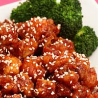 Sesame Chicken · Served with rice.