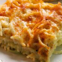 Baked Macaroni  'N' Cheese · #5 Noodles Baked in 5 Delicious Cheeses Including Cajun Queso.