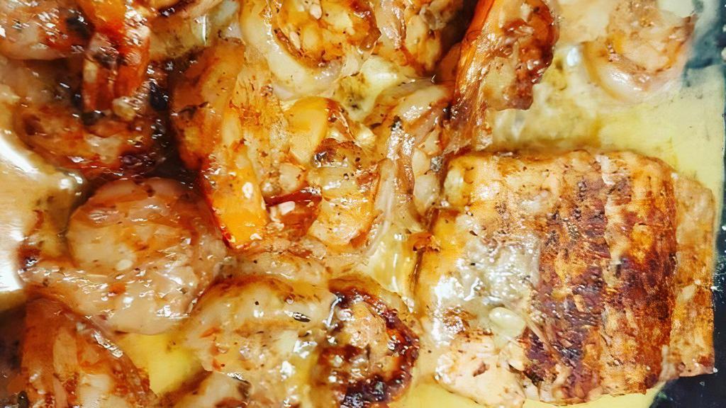 Creamy Garlic Butter Salmon & Shrimp  · Seared Salmon and Shrimp sauteed in a creamy garlic butter sauce