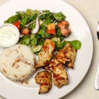 Chicken Shish Kebab · All natural chicken breast chunk marinated and grilled. Served with rice and salad.