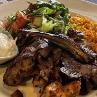 Mix Grill · One piece kefte, two pieces chicken shish, one piece lamb chop and gyro meat. Served with ri...