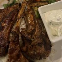 Lamb Chops · Four pieces grilled and marinated. Served with rice.