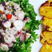 Ensalada De Pulpo Con Tostones · Octopus Salad with Fried Plantains.