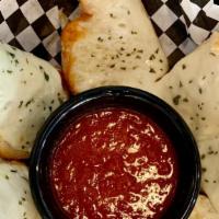 Cheesy Garlic Bread · Toasted loaf smothered with garlic butter and melted mozzarella cheese. Served with a side o...