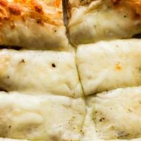 Cheesy Bread · Baked dough with mozzarella cheese baked right in.