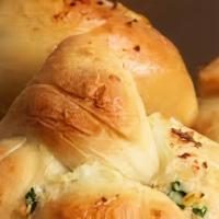 Garlic Rolls · Home baked garlic rolls.  Garlic oil and parmesan cheese.  Absolutely delicious.