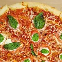 Manhattan Margherita Pizza · Light tomato sauce, sliced tomatoes, buffalo, mozzarella cheese, olive oil, oregano and basil.