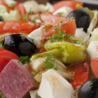 Italian Antipasto Salad · Genoa salami, ham, provolone cheese over romaine lettuce with tomatoes, green and black oliv...