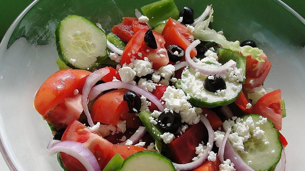 Greek Salad · Iceberg and romaine lettuce, carrots, red cabbage, tomatoes, onion, green and black olives, peperoncino and feta cheese.