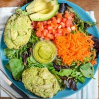 Cilantro-Lime Avocado Chicken Salad · Whole stuffed avocado, served with organic spring mix salad, tomato, carrot with homemade ve...
