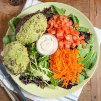 Avocado Quinoa Salad · Vegan. Organic spring mix salad, tomato, carrot, served with a whole avocado stuffed with ou...