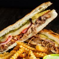 Cuban Sandwich · House-roasted pork, smoked ham, melted Swiss cheese, pickles and mustard pressed and  toaste...
