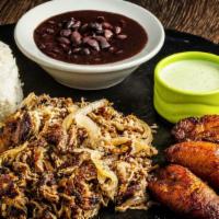 Roasted Pork (Lechon Asado) Plate · Our famous roasted pork sauteed with mojo and onions served with black beans, white rice and...