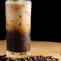 Iced Cafe Con Leche · Shot of cuban espresso with brown sugar and cold milk over ice.