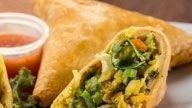 Vegetable Samosa · Mildly spiced potatoes and peas stuffed in a light pastry.
