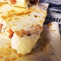 Chicken Bacon Ranch Quesadilla · Grilled chicken breast, crisp bacon, homemade ranch dressing and mozzarella  cheese, toasted...