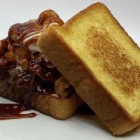 Backyard Burger · Pulled pork, Mac & cheese, bacon, apple butter BBQ sauce, pickle on Texas toast
