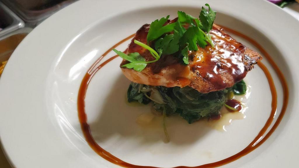 Salmon · Grilled Atlantic salmon with. a bourbon glaze served on a. bed of spinach with choice of. side and a house salad