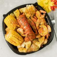 2 Crab Clusters And 1 Lobster Tail · 2 Snow Crab Clusters and 1 Lobster Tail Steamed in Cajun Garlic Butter