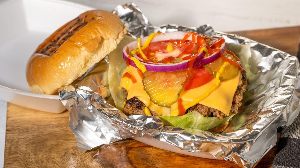 Big Boy Burger · Classic 1/3 lb burger topped with American cheese, lettuce, tomato, onion, pickles, ketchup, mustard.