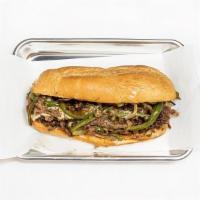 Steak Philly · Thin-sliced beef with peppers, onion, and cheese on a toasted hoagie bun.