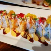 Sri Thai Roll · Shrimp tempura, snow crab meat, cucumber and avocado topped with smoked salmon and masago se...