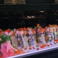 Candy Roll · Shrimp tempura, avocado, asparagus and tempura flake topped with cream cheese roll with eel ...