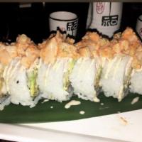 Ocean Roll · Shrimp tempura, fish tempura, snow crab meat, avocado, cucumber topped with spicy raw scallo...