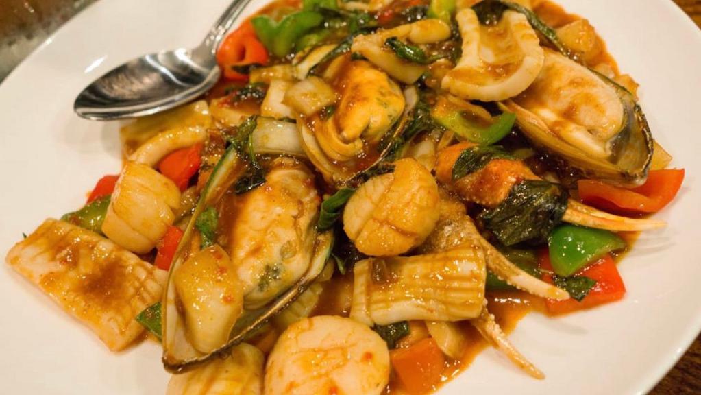 Spicy Basil Seafood · Mussel, scallop, squid, shrimp, onion, basil and bell pepper sautéed in spicy basil sauce.