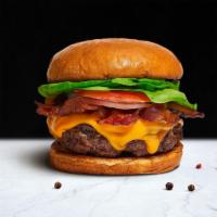 Never Been Bacon Burger · American beef patty and topped with melted cheese, multiple layers of crispy bacon, mayo, ke...